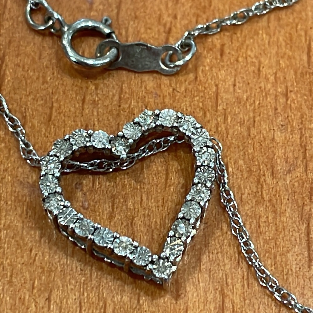 Sterling Silver and Diamond heart necklace with 18” rope chain.